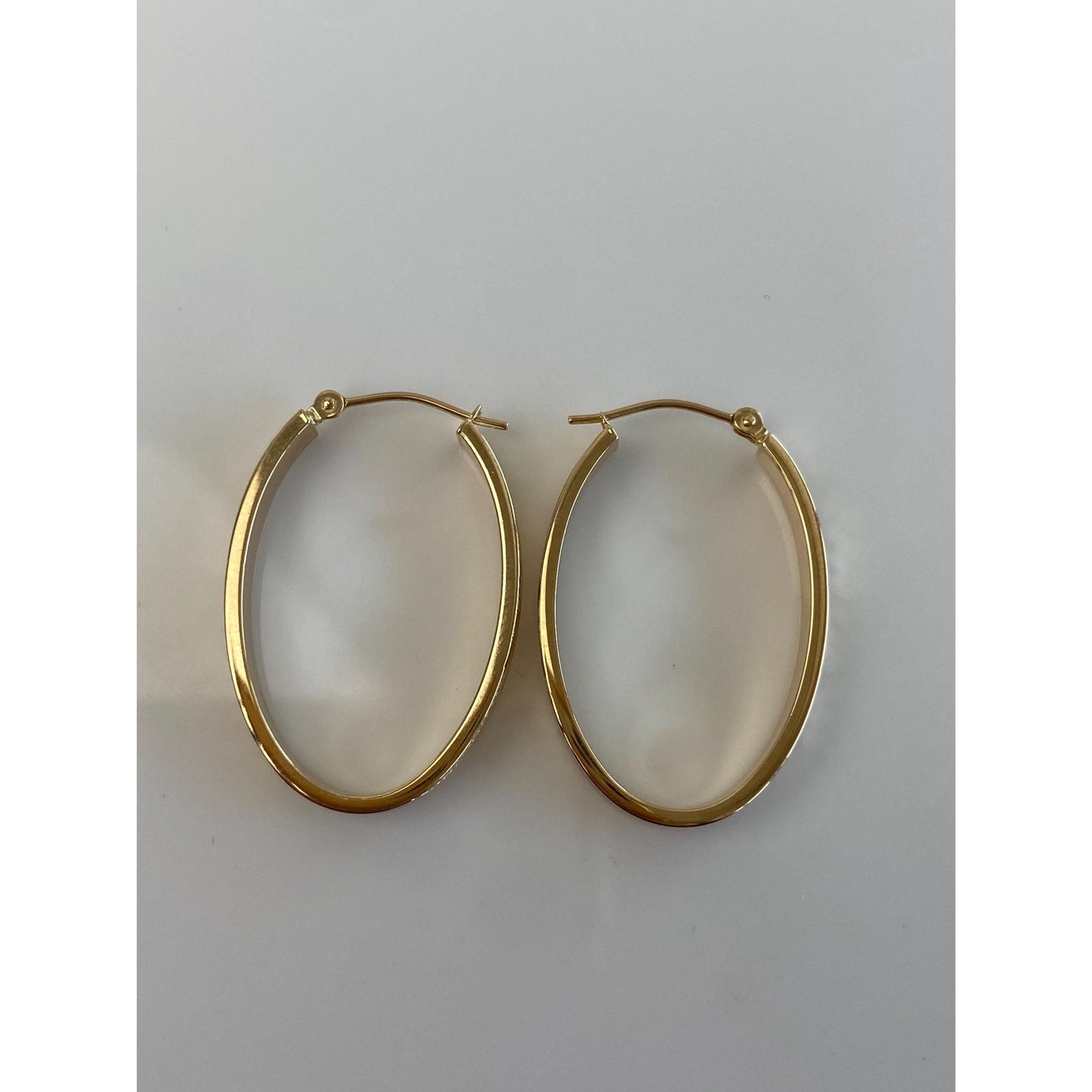 Vintage 14k Yellow Gold Diamond Cut Oval Hoop Earrings